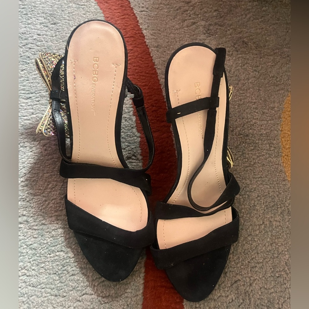 Lightly used BCBG heels with side bow.